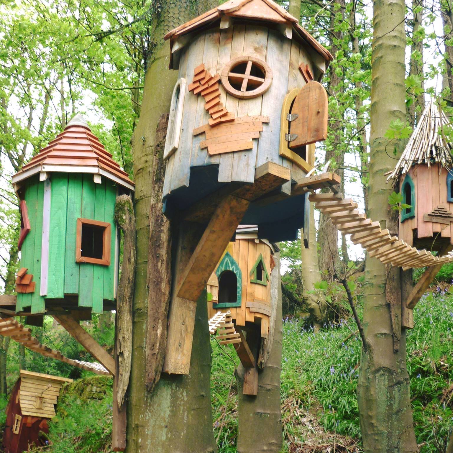 Whimsical fairy tree houses in a forest setting