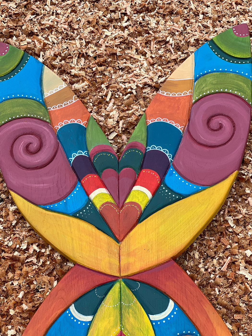 Close-up of colorful butterfly wing design on fairy chair