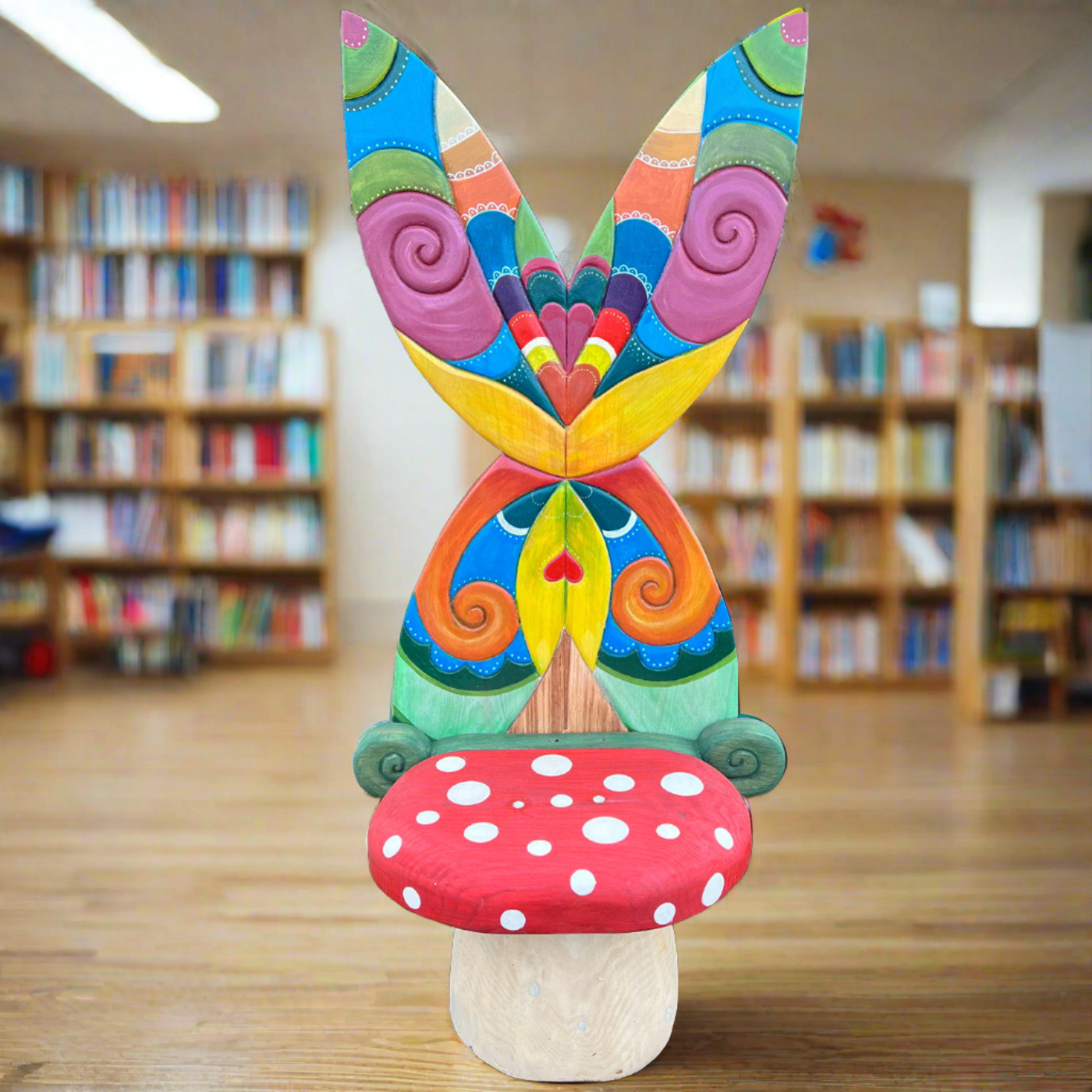 Colorful mushroom fairy chair with butterfly wings in library