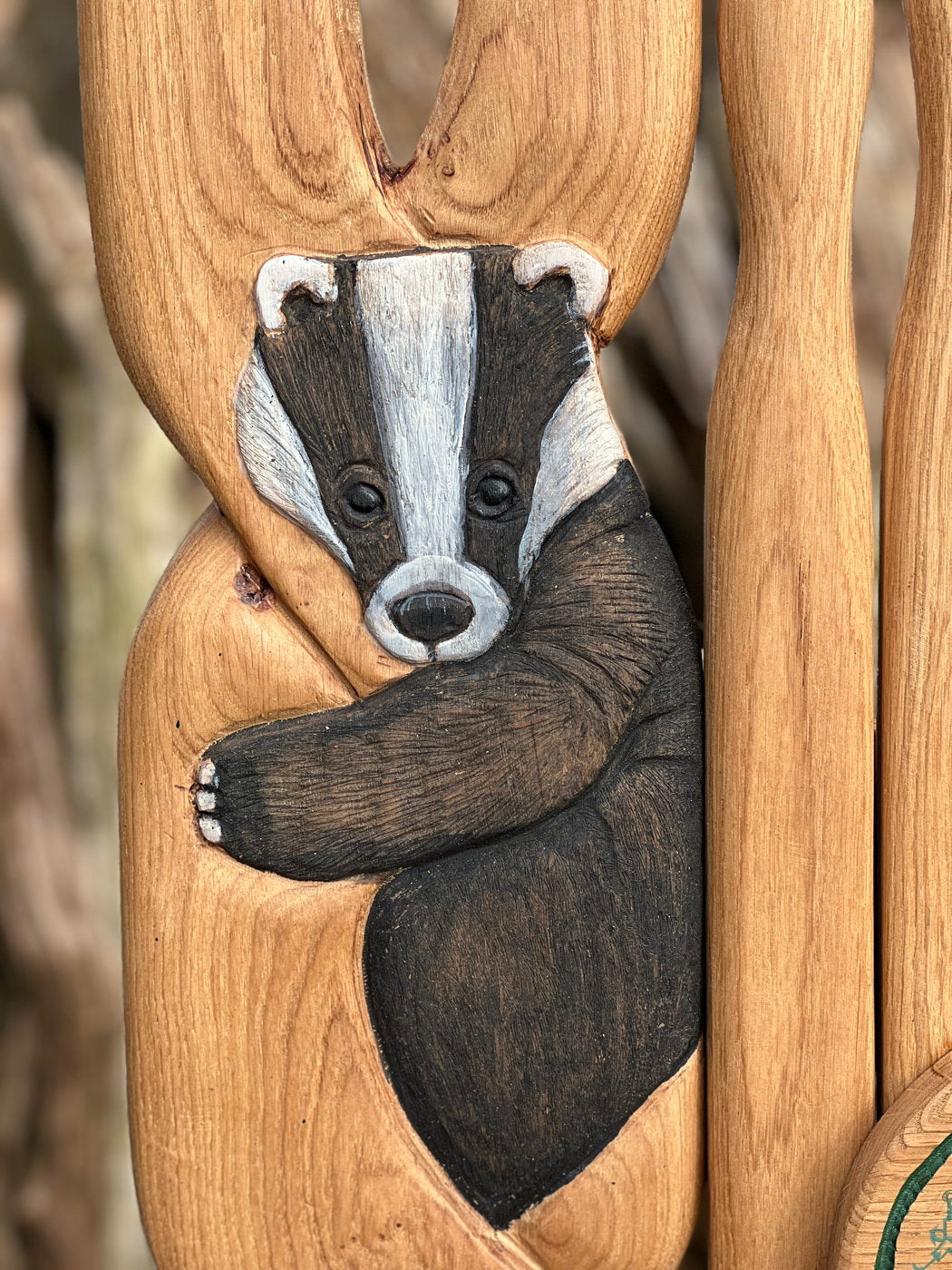 Detailed carving of badger on wooden chair