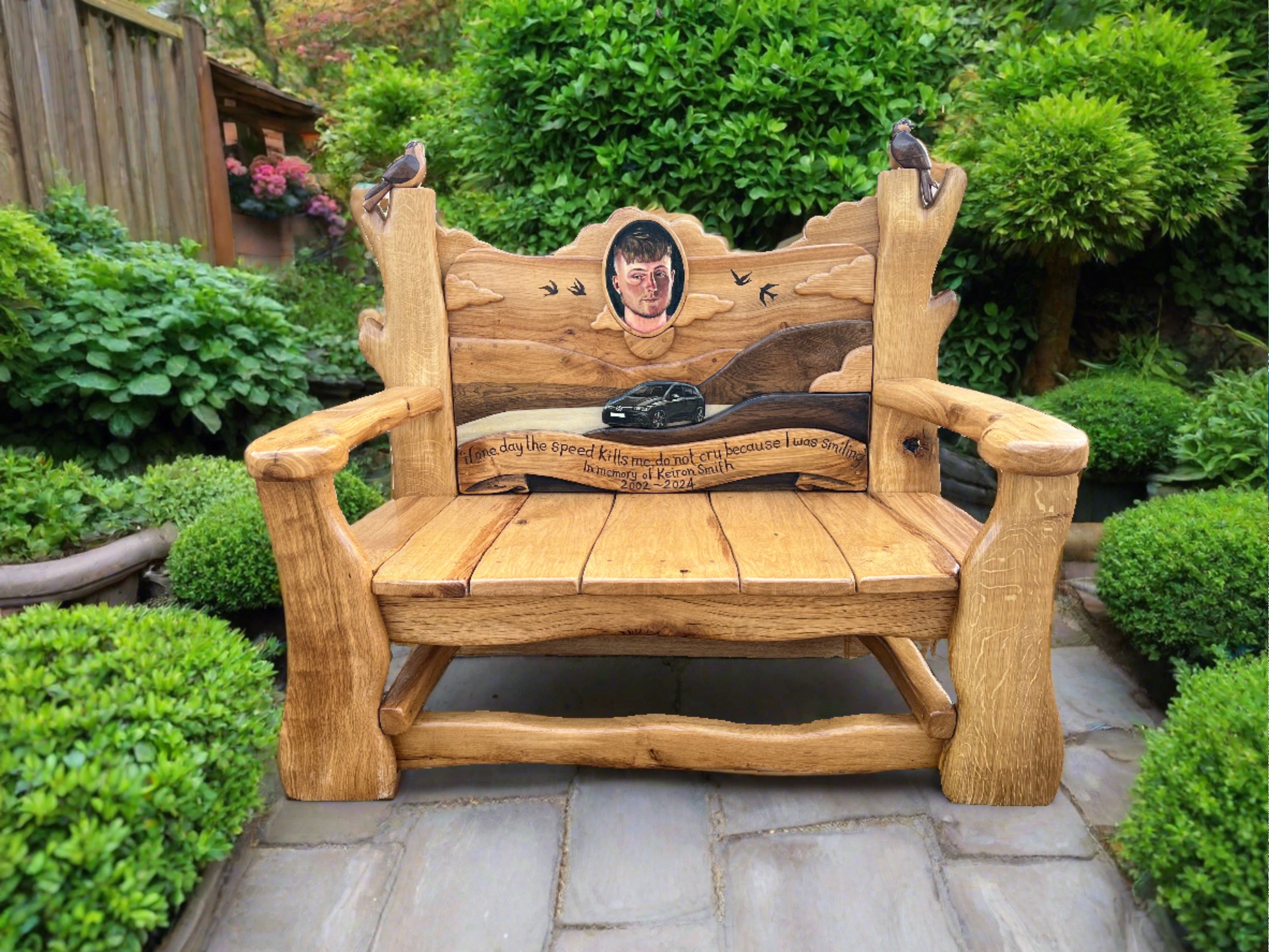 Wooden bench with car carving and dedication