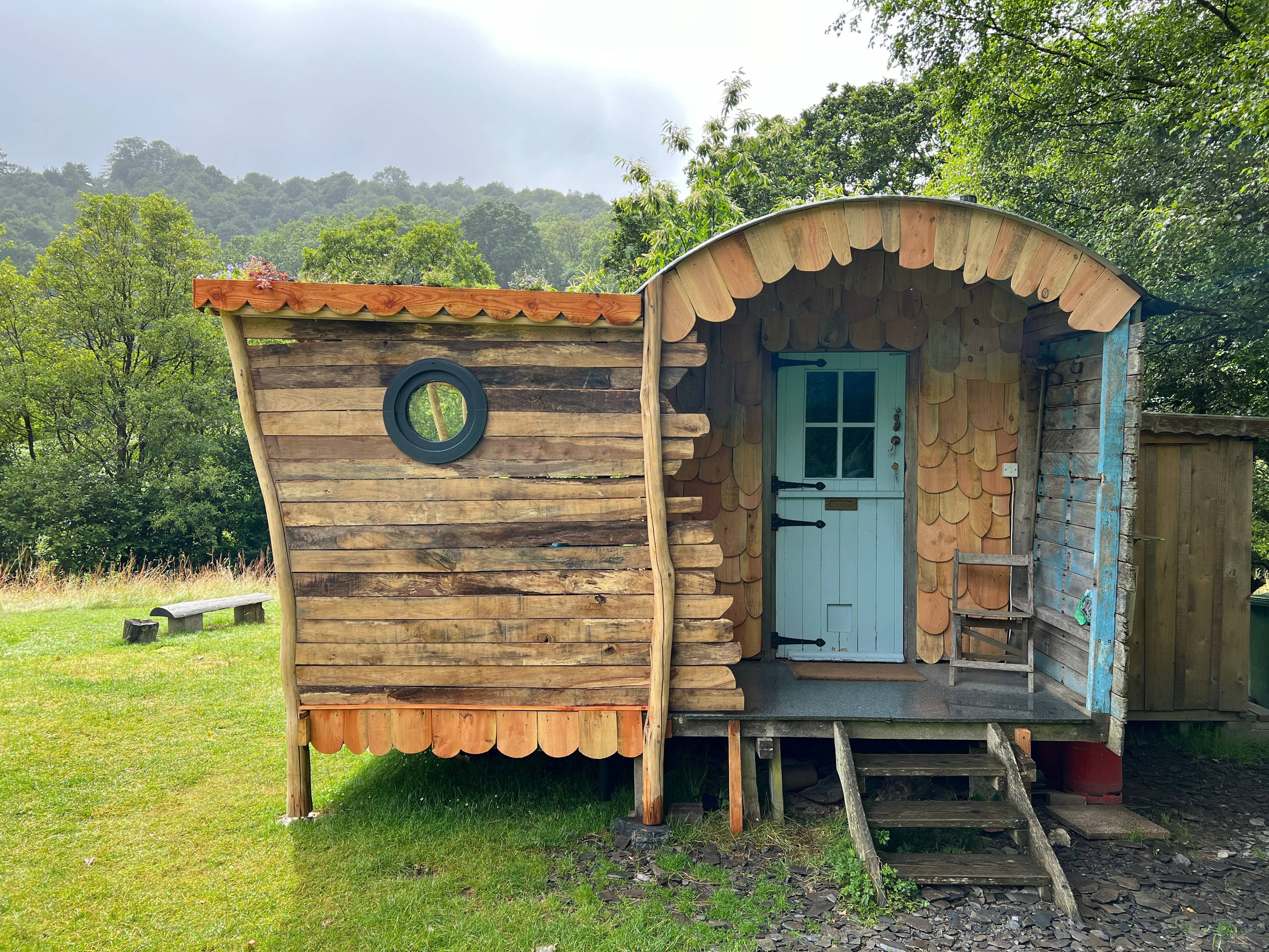 Front view of wooden shepherd's hut with steps