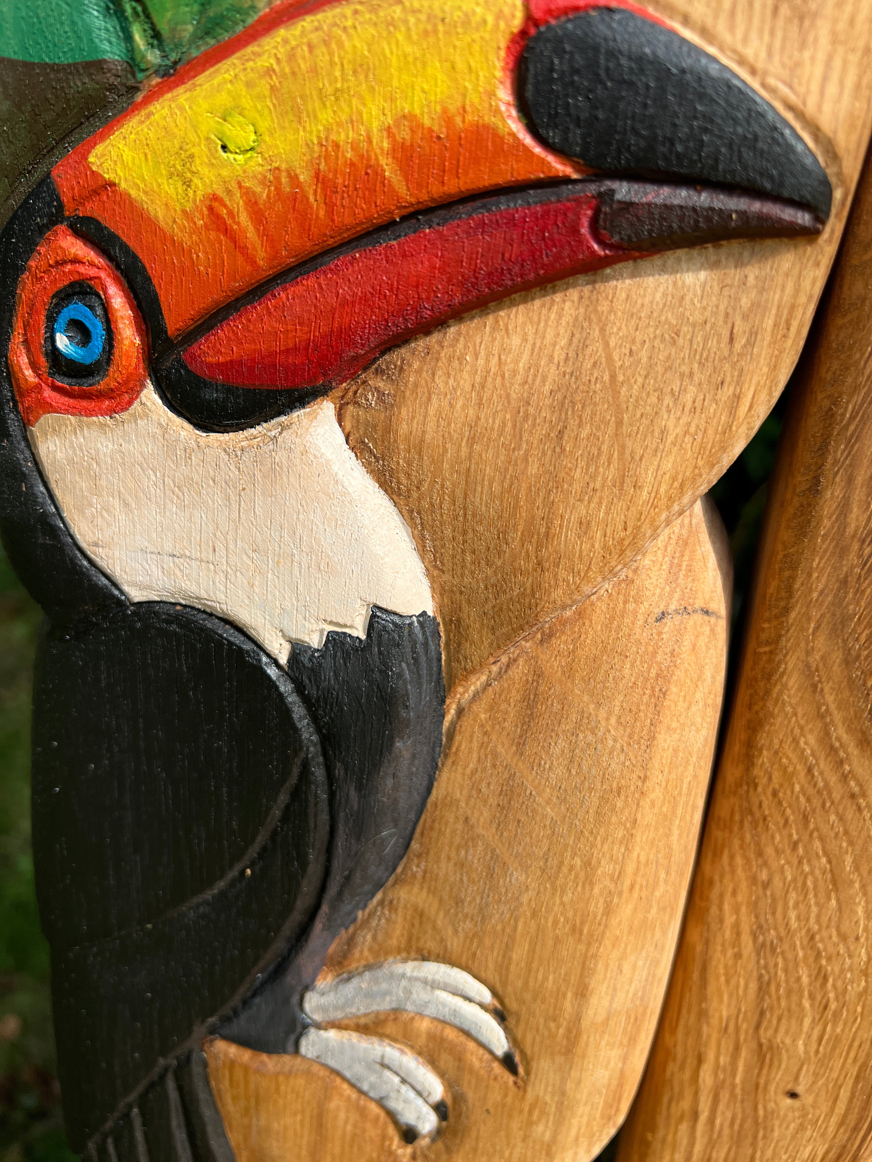 Detailed toucan carving on Amazon Adventure Chair