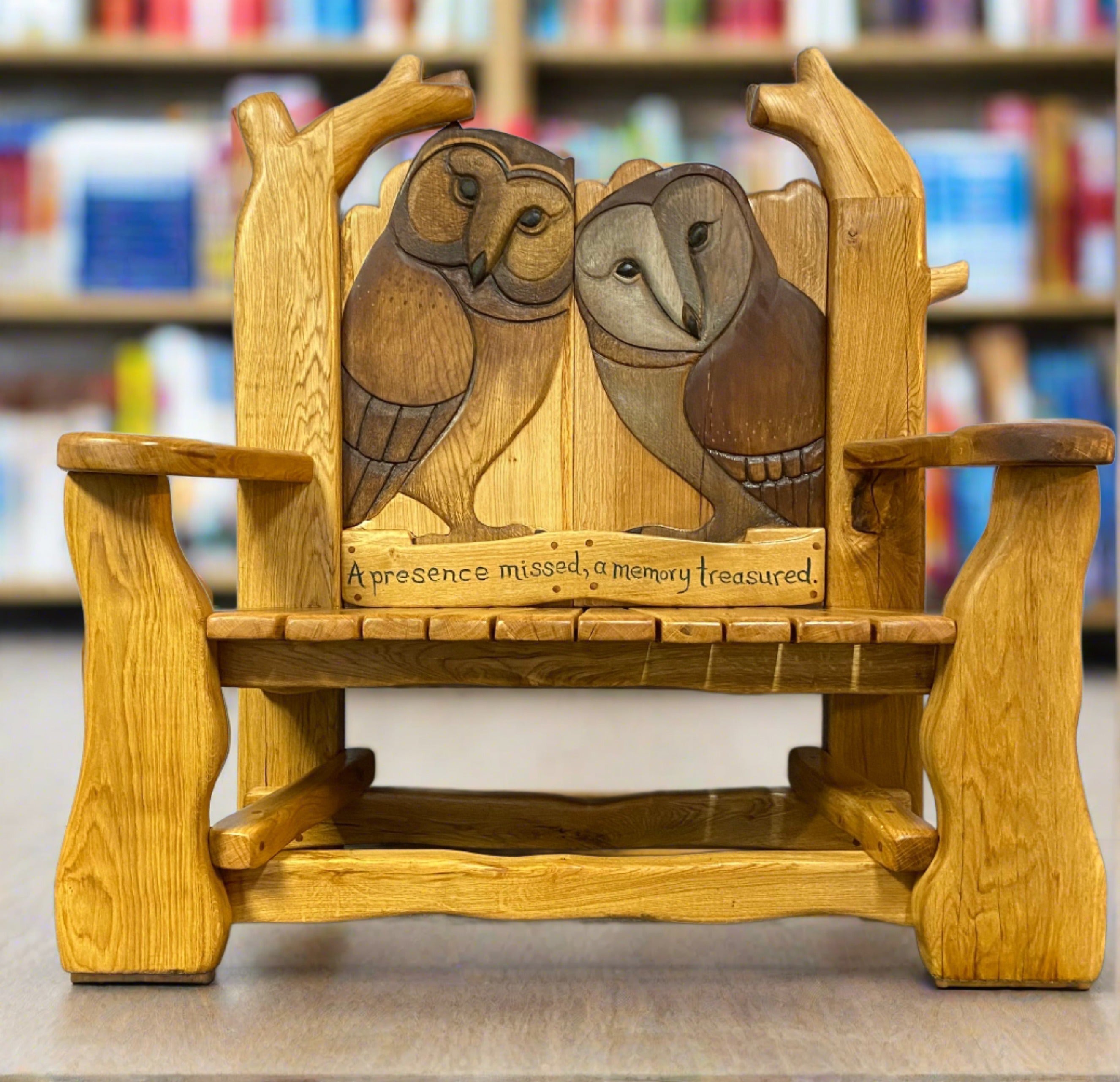 Owl-themed wooden bench in library setting