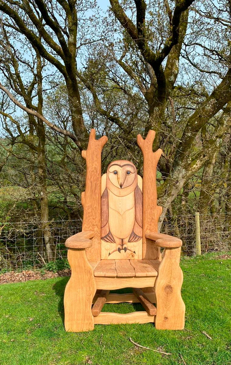 Owl storytelling chair under trees