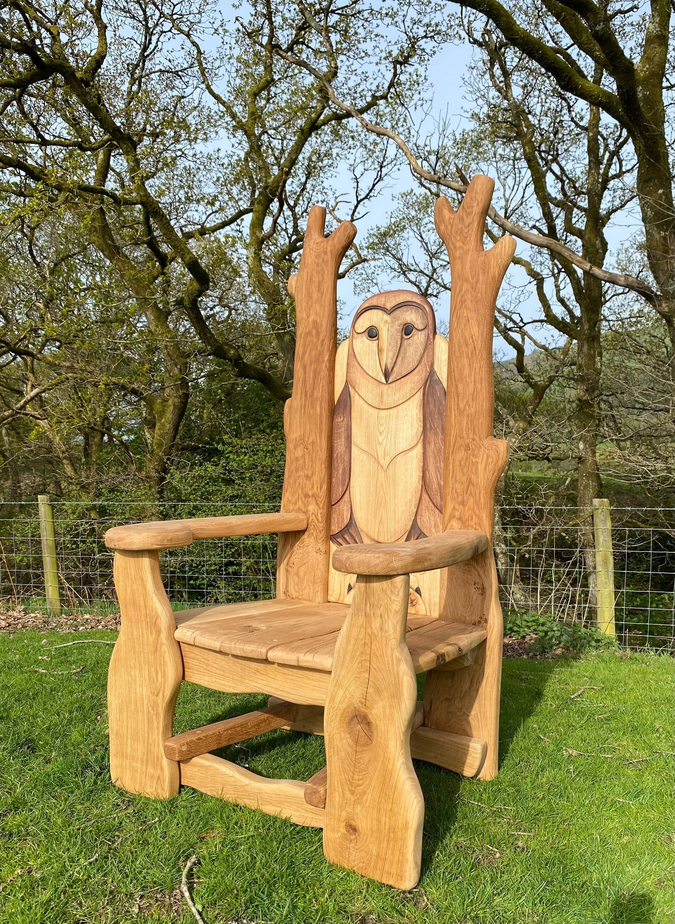 Oak owl reading chair in wooded area