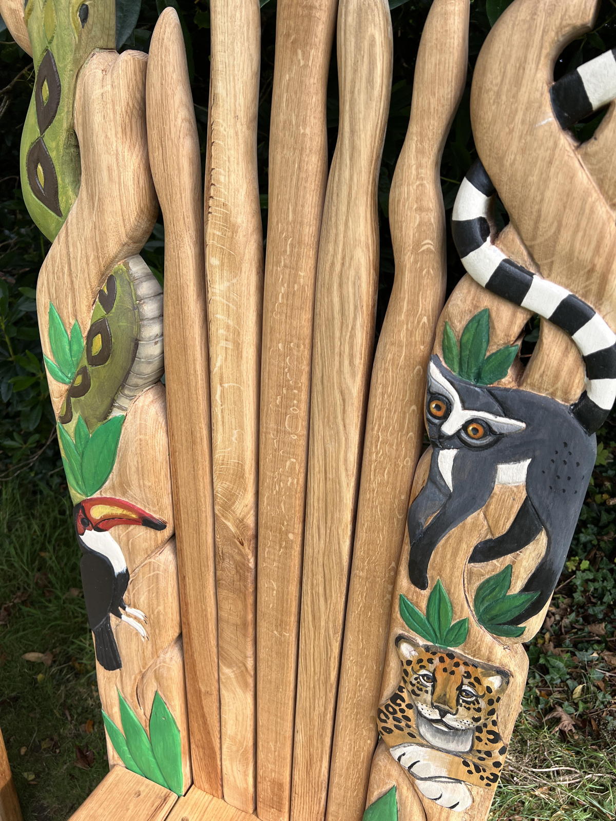 Jungle-inspired chair with toucan, jaguar, lemur