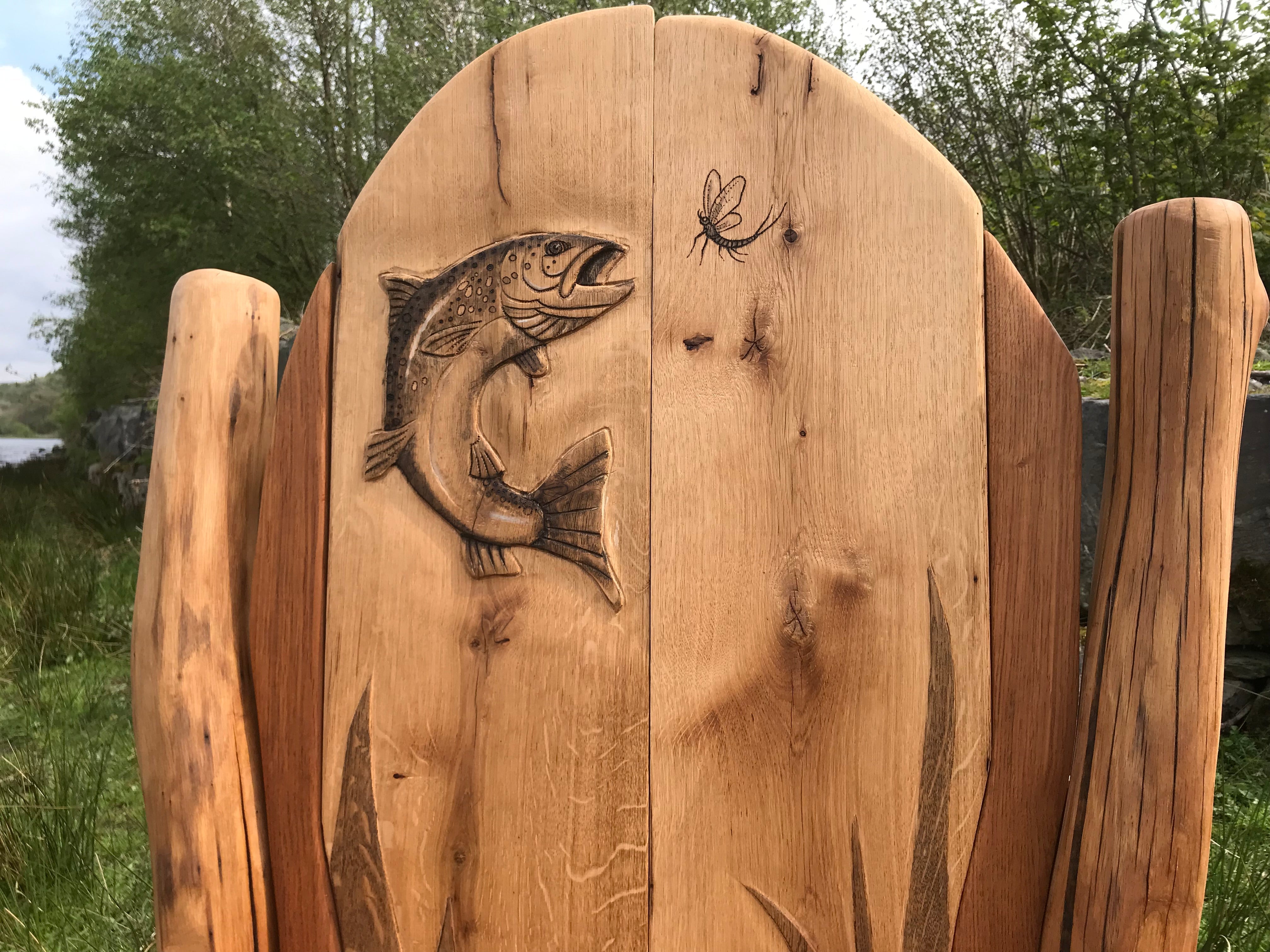 Close-up of fish carving on wooden bench