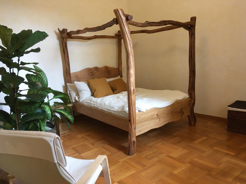 Rustic chunky four poster tree bed