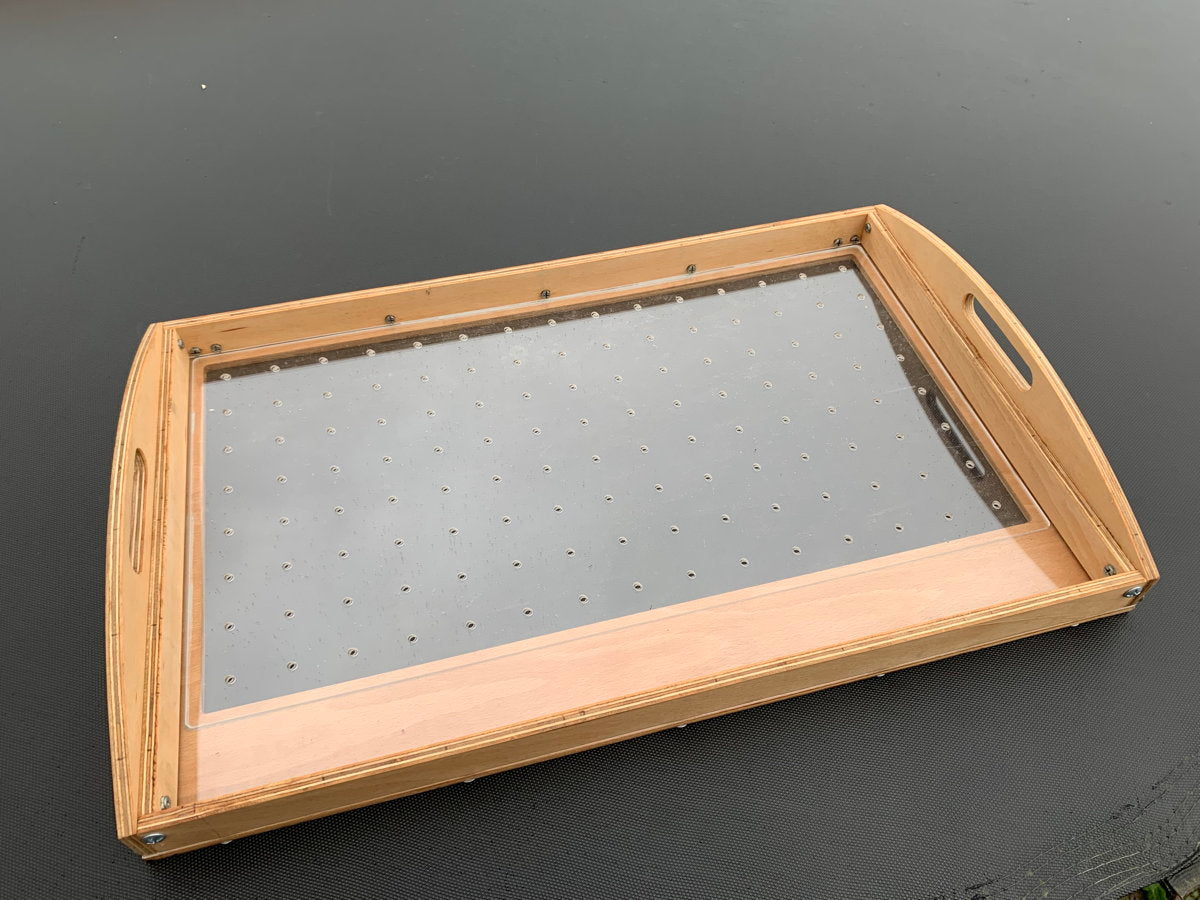 Top view of seed sowing tray with handles