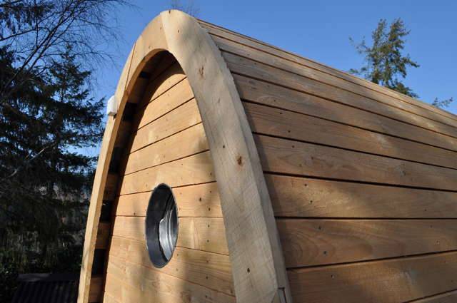 Close-up of Timber Arc Composting Toilet's wooden exterior