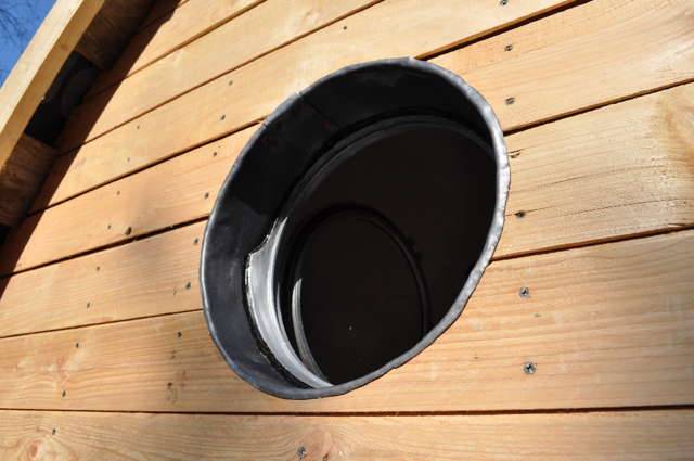 Circular window detail on Timber Arc Composting Toilet