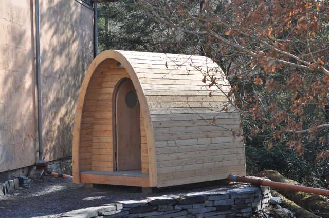 Timber Arc Composting Toilet in garden environment