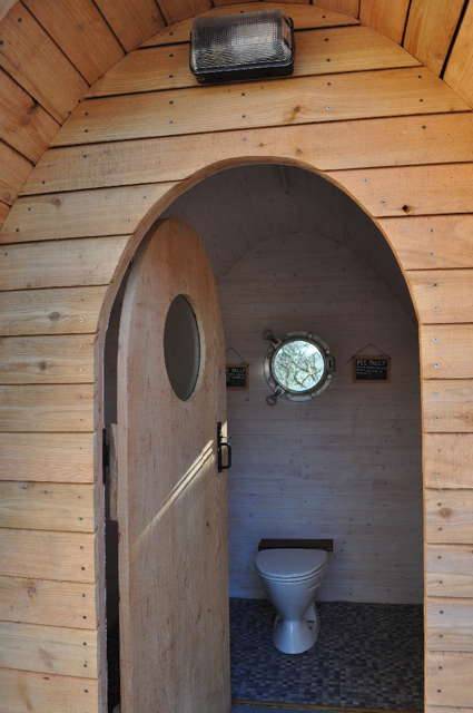 Interior view of Timber Arc Composting Toilet with door open