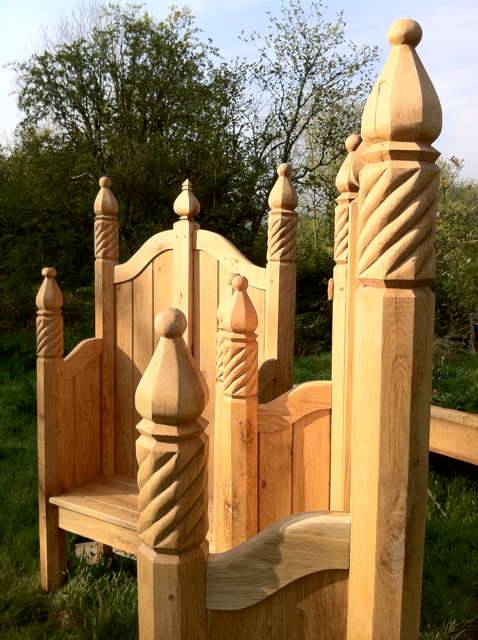 Detailed view of carved storytelling chair posts