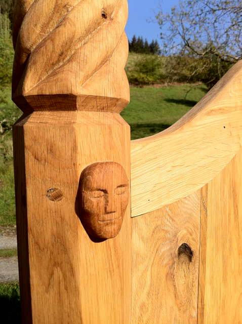 Close-up of carved face on storytelling chair