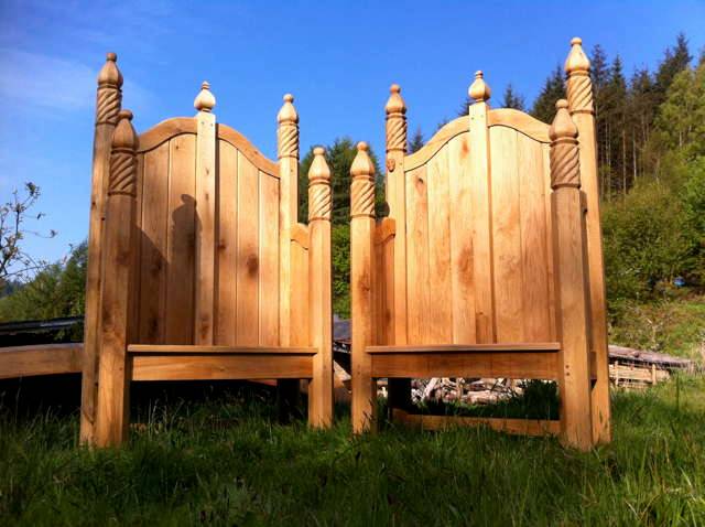 Pair of storytelling chairs with carved posts