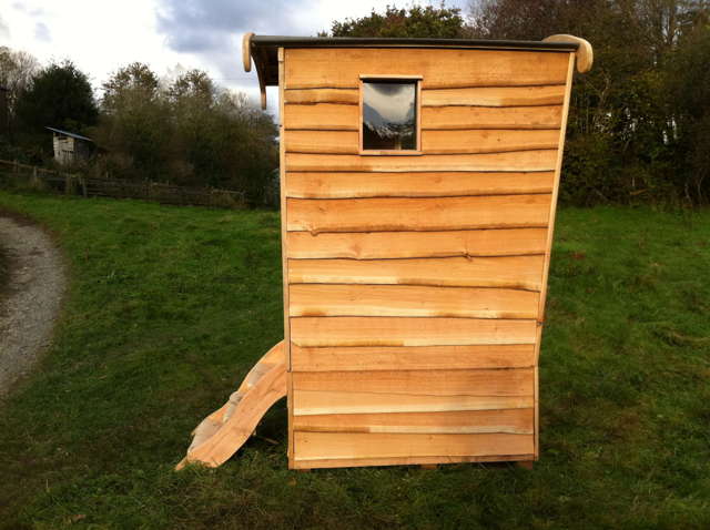 Side profile of wooden compost toilet