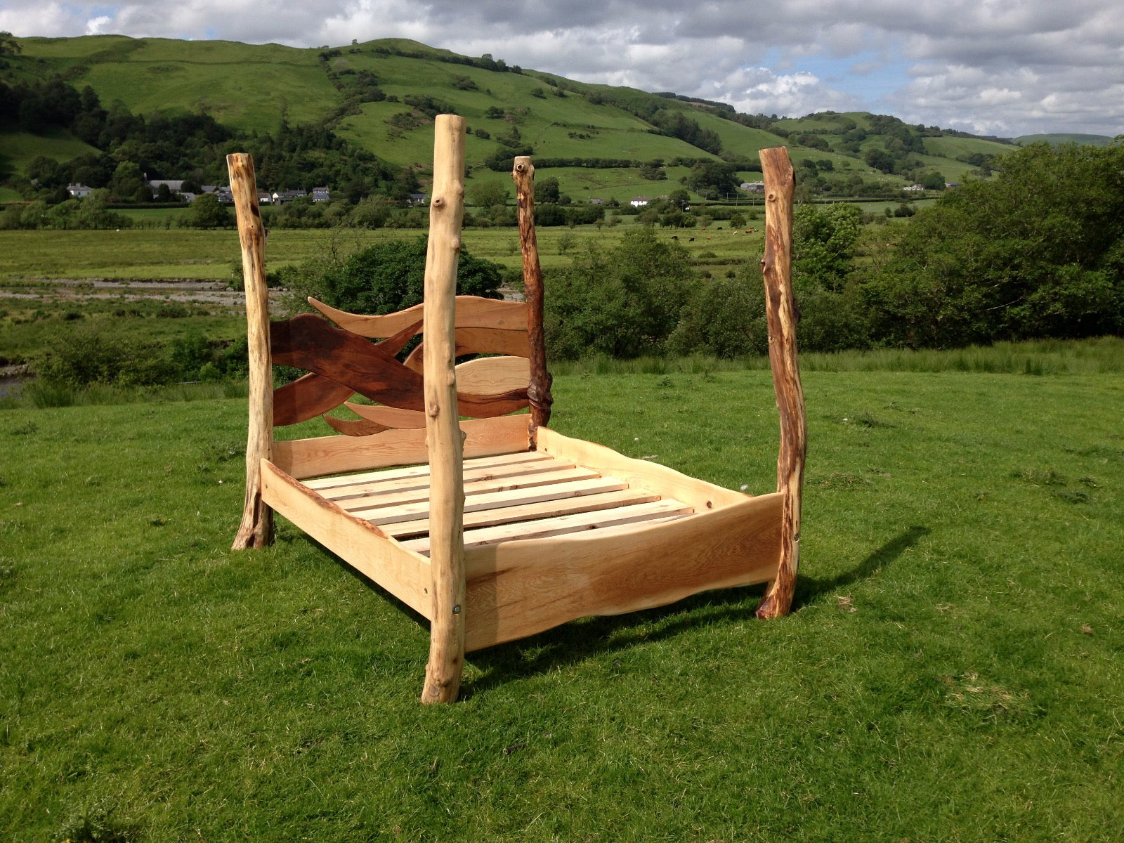 Handcrafted driftwood bed frame with natural wood finish