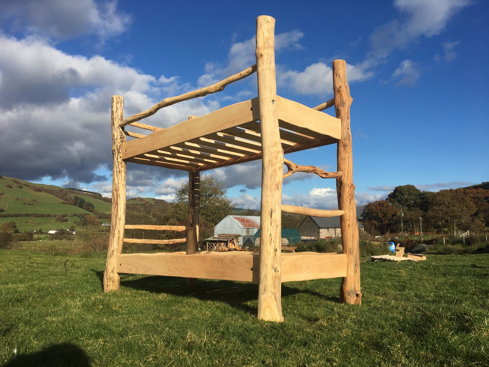 Sturdy driftwood bunk bed under blue sky