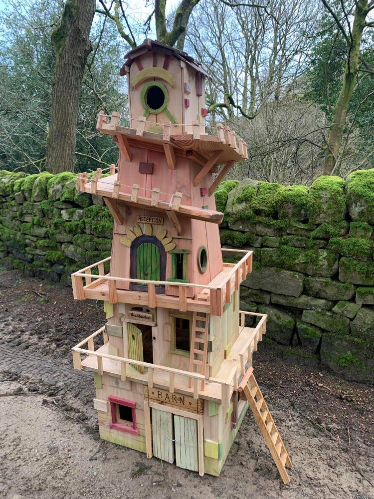 Multi-story fairy house with intricate details