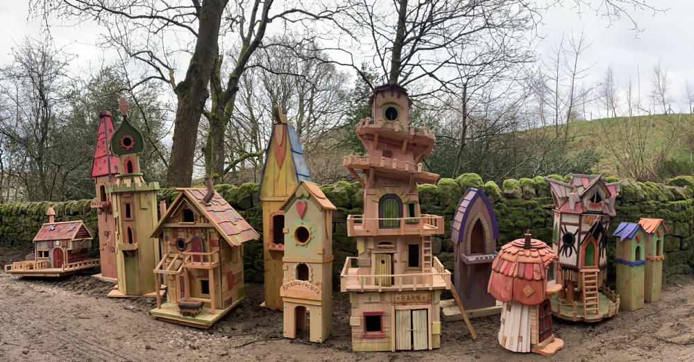 Array of fairy houses with unique architectural styles