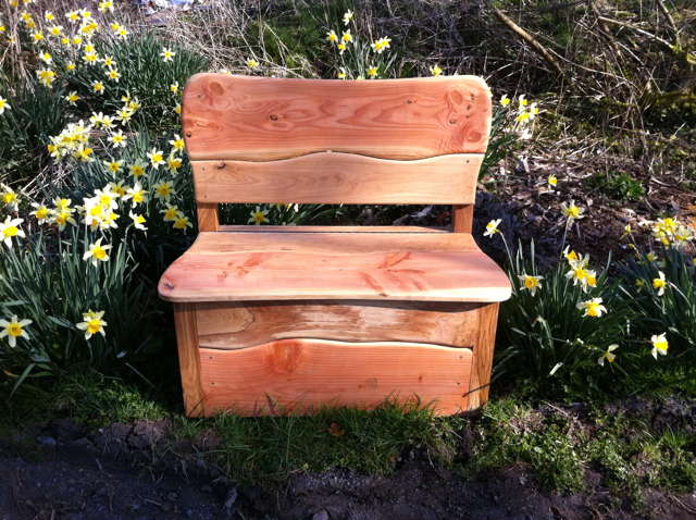 Two-seater garden bench with natural wood finish