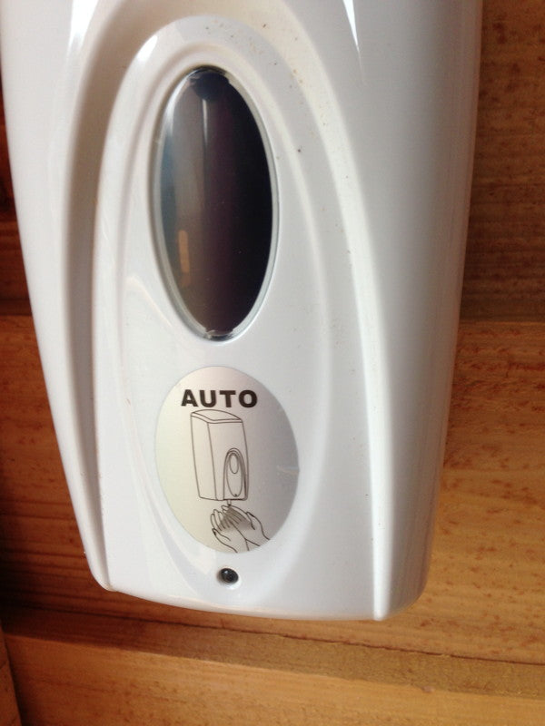 Automatic soap dispenser inside compost toilet