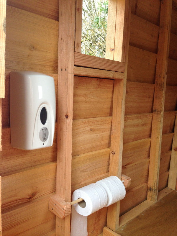 Interior of compost toilet with soap dispenser