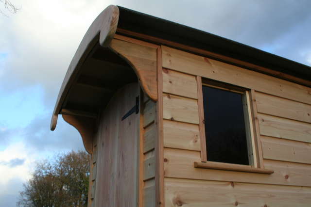 Close-up of wooden composting toilet roof detail