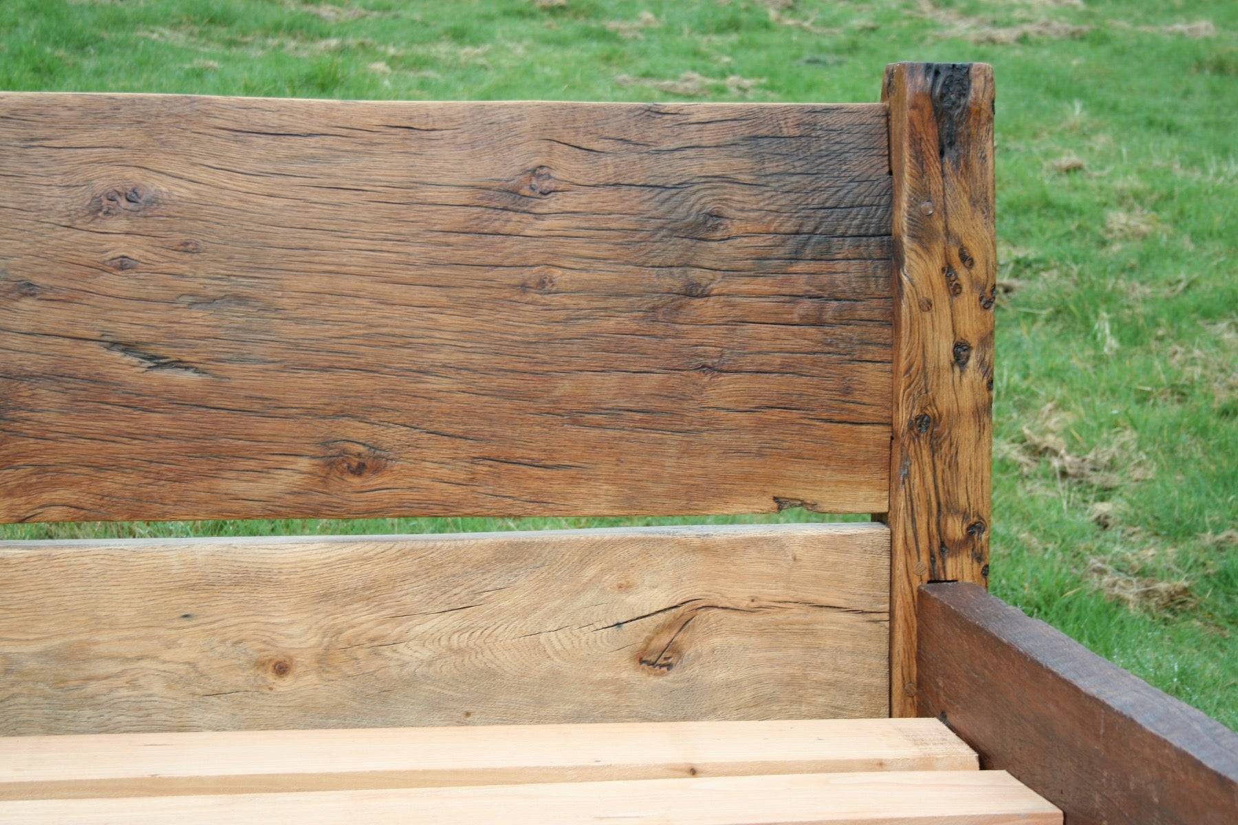 Reclaimed oak bed with visible wood grain