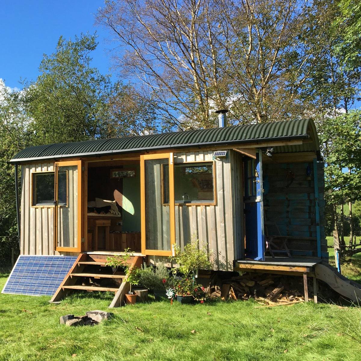 Shepherd's hut with solar panel and open doors