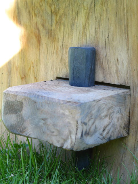 Close-up of oak and slate bench detail